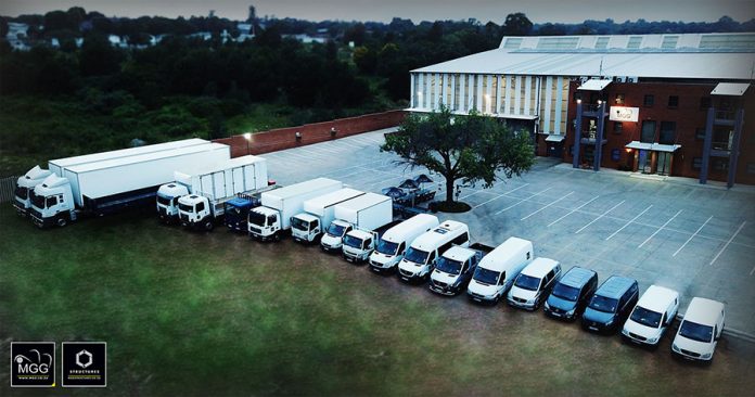 MGG vehicles outside warehouse